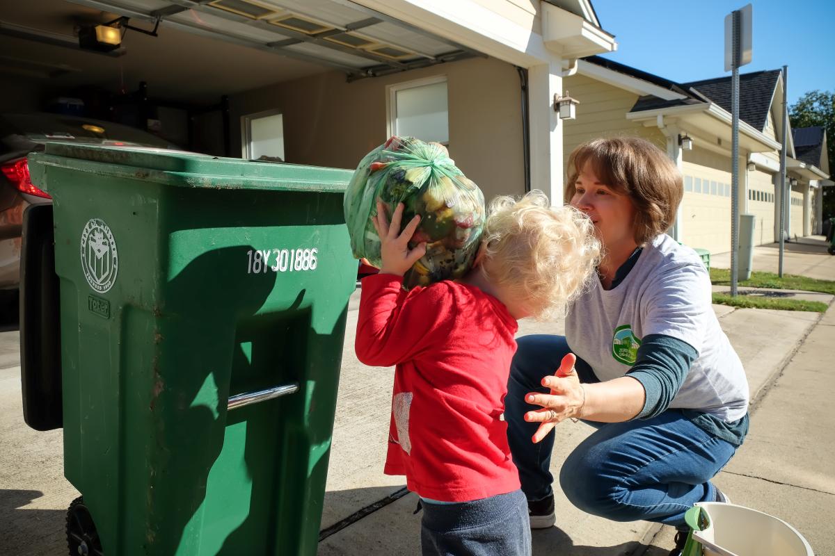 Taylor and her son composting