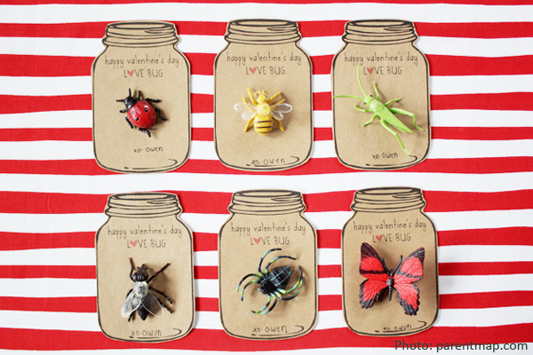 Six home-made cards in the shape of mason jars with bugs on them. Background is white and red striped.