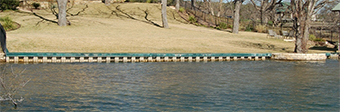 A typical bulkhead constructed to prevent shoreline erosion on Lake Austin. Bulkheads reduce shoreline habitat