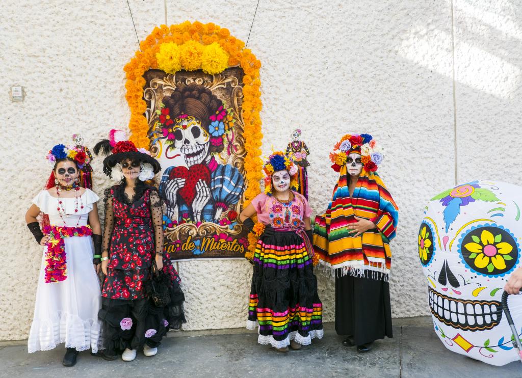 Children attending the 2021 Day of the Dead Celebration in skull-like face paint 