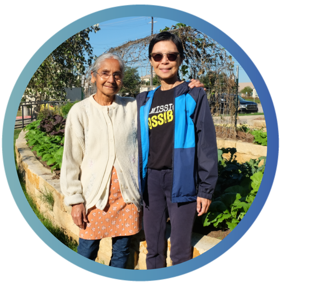 Himadri Patel and Niki Mungcharoen stand outside near the Asian American Resource Center's community garden.